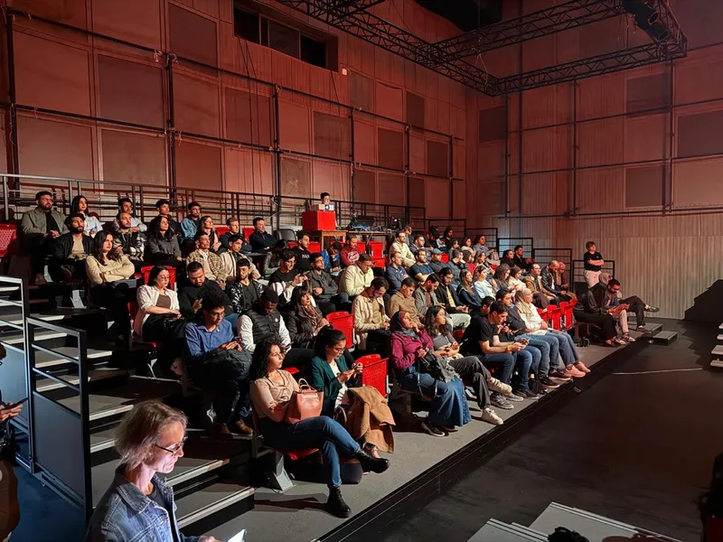 Attendees looking at a talk